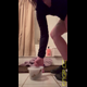 Miss Marilyn squats over a clear container in a bathroom and shows the poop in it. Presented in 720P vertical HD format. About 1.5 minutes.